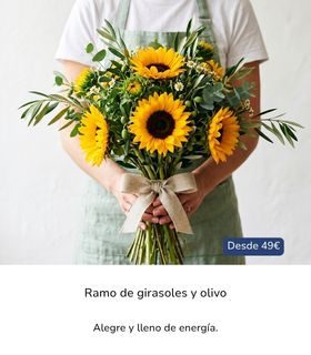 Ramo de girasoles amarillos con hojas verdes y ramas de olivo, sostenido con ambas manos por un florista
